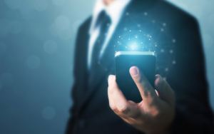 Businessman Hand Holding Mobile Phone With Global Network Connection