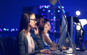 Technical Support Agents Working In Office At Night